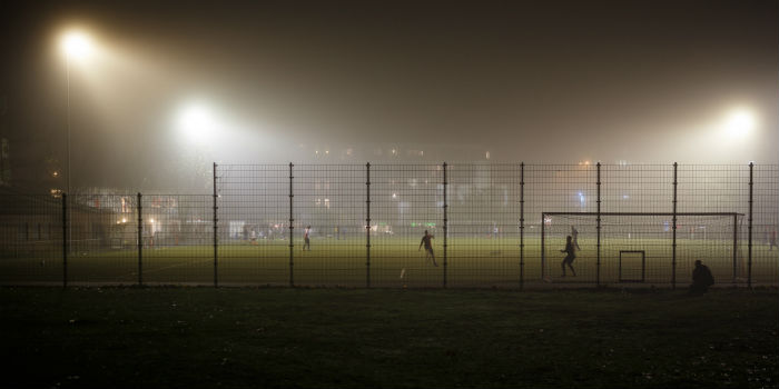 On the left are the traditional stadium lights on a football field and to the right are the new lights. Photo: Robert Anders