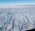 Surface meltwater streams cut into the ice sheet surface in Western Greenland during summer. These streams will eventually plunge to the rock bed beneath where the water can cause speed changes in the glaciers above as they slide towards the coast. DTU Space and Scientists from Université Grenoble Alpes have discovered that water can get from the surface to the bedrock even in winter when air temperatures are below the freezing point. (Photo: Nathan Maier)